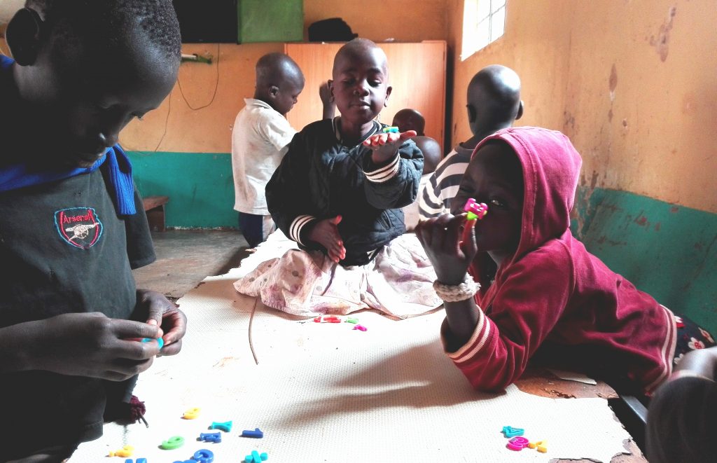 kids playing with abcs